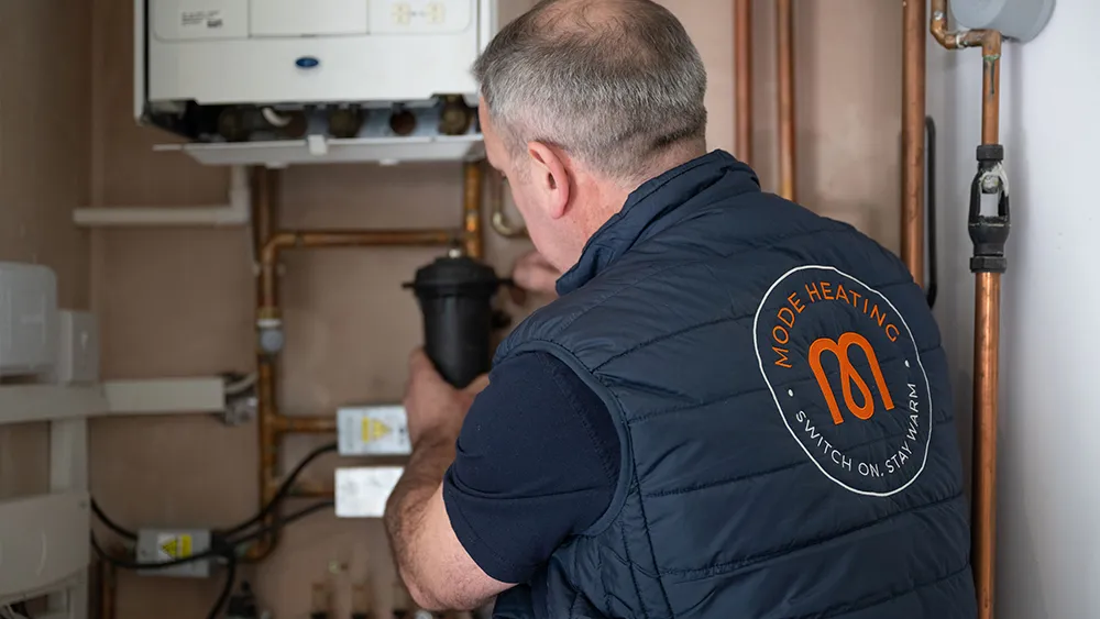 Sludge build-up inside a heating system restricting water flow